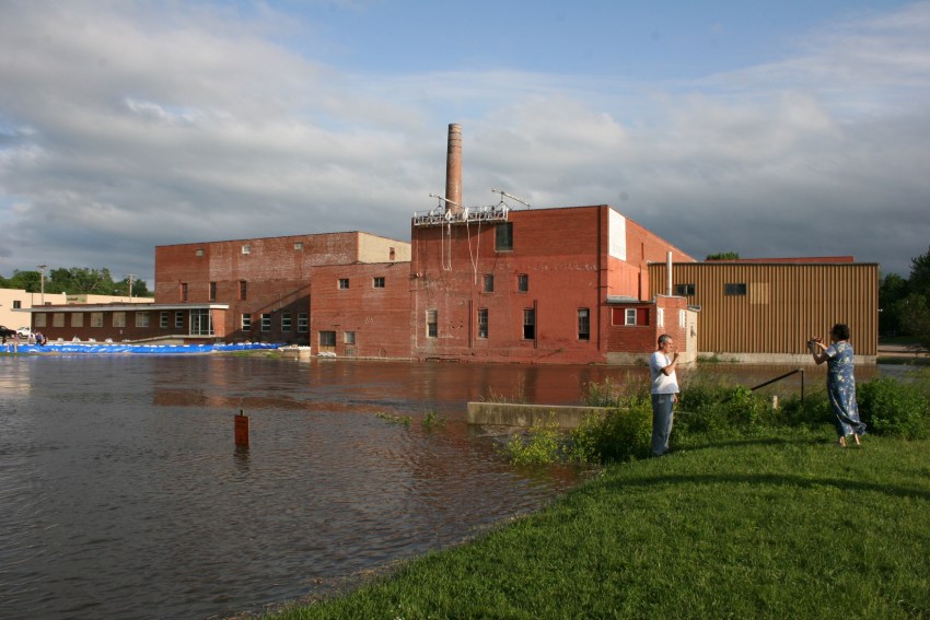 Photographing the rising Cannon River. The dam here is no longer visible.