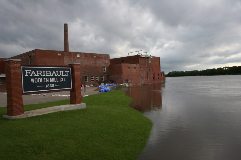Sandbags protect the Faribault Woolen Mill from the rising Cannon River.