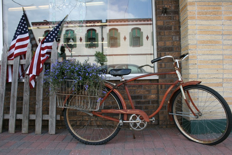 A summery patriotic scene outside the shop.