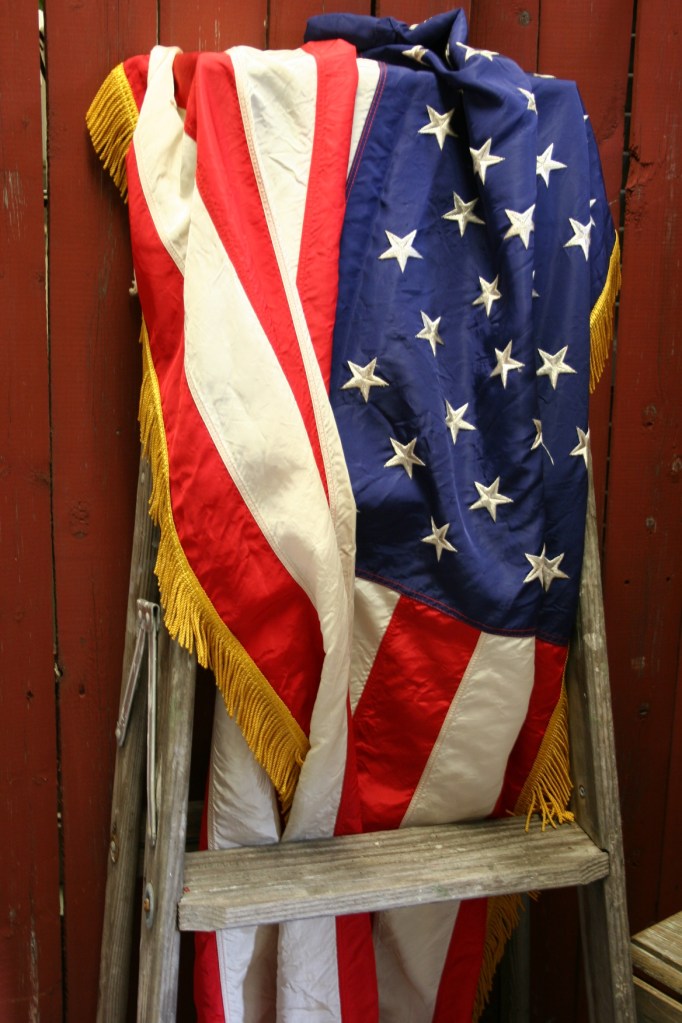 Fourth of July, flag on ladder