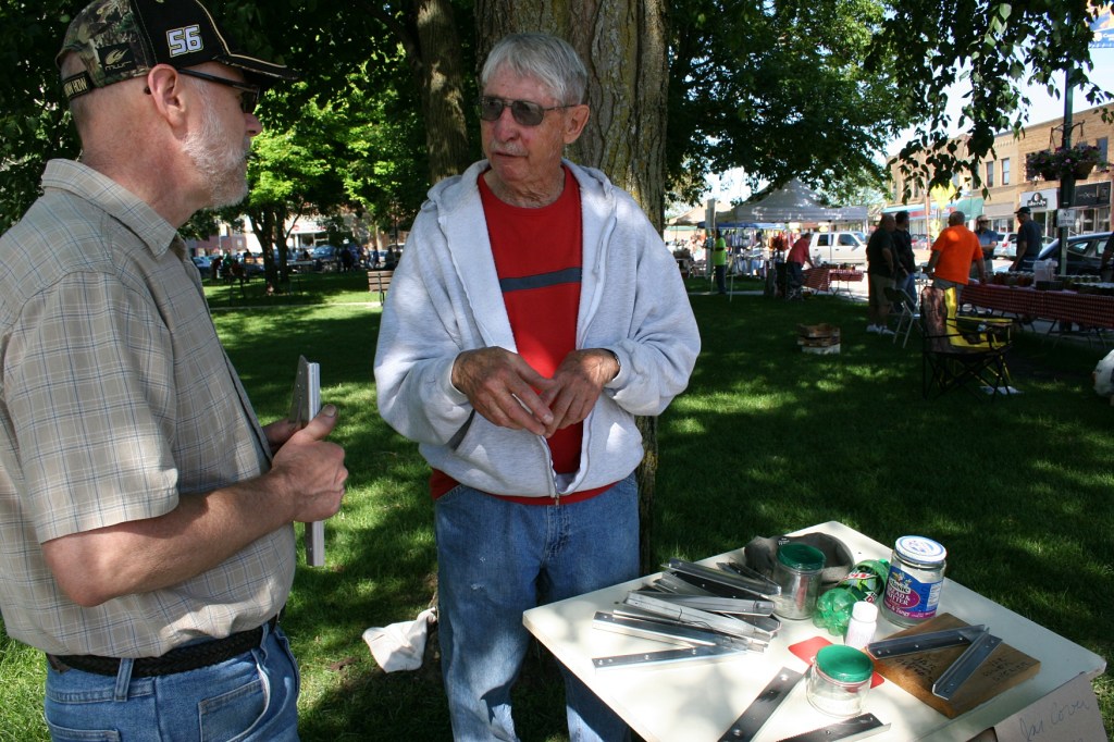 Gene Mosher talks to my husband, Randy, about his jar cover opener.