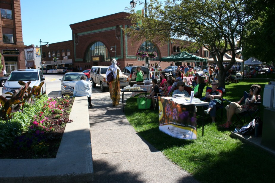 Another shot of the busy market, which gets even busier once gardens really begin producing. Then vendors are set up along the sidewalk and on the grass.