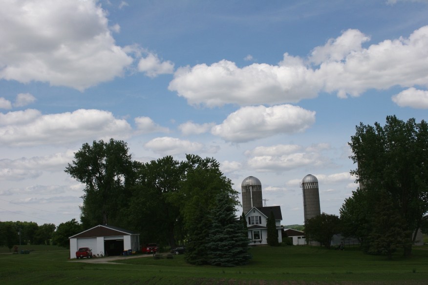 Sunday drive, farmsite with red trucks
