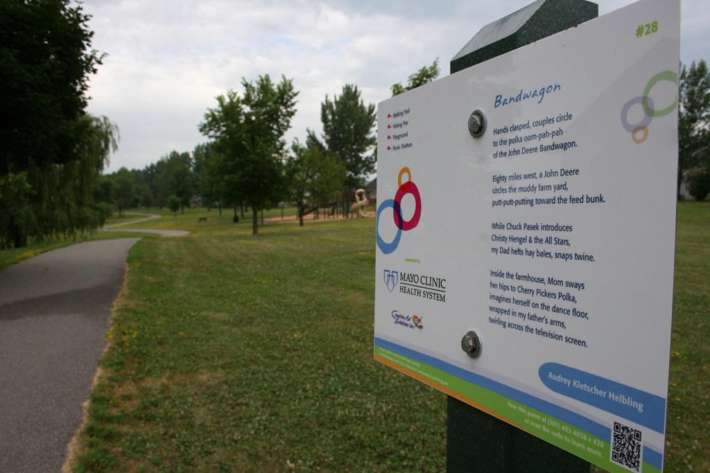 A recreational trail winds past my poetry sign in Lions Park North.