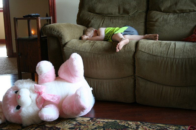 Boy sleeping, bunny on floor