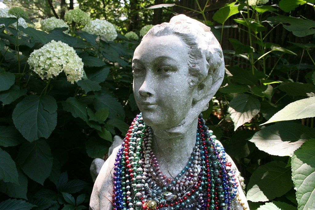 At first glance, I thought this simply a woman draped in beaded necklaces.