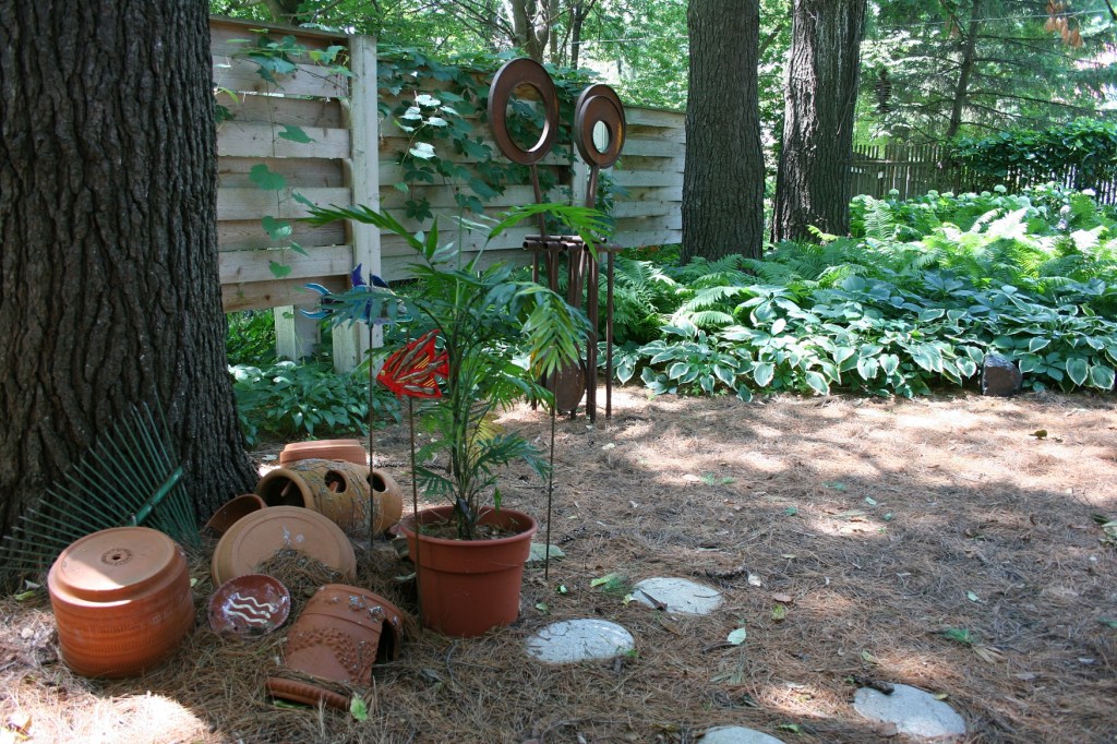 The garden art includes original sculptures by Jennifer Wolcott.