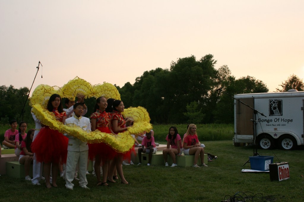Chinese youth perform as the sun sets.