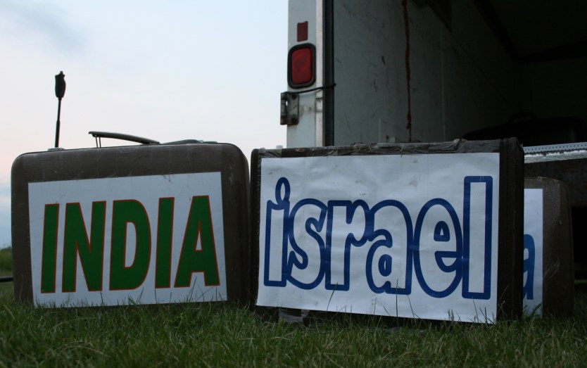 Labeled suitcases were placed on the grass to inform the audience of the culture featured.