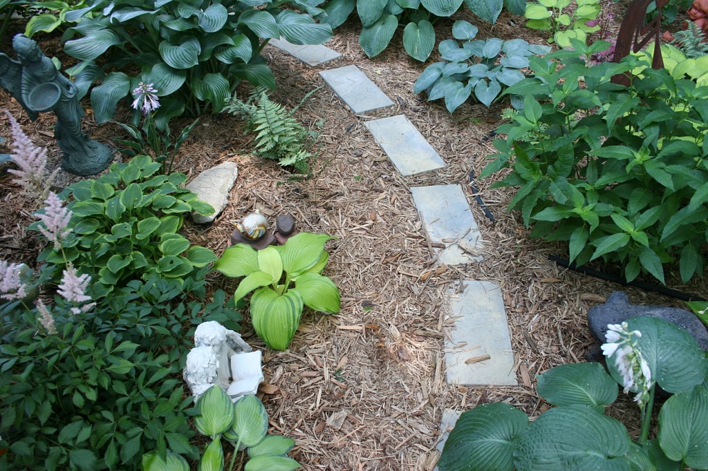 Shade-loving plants fill the Valhalla garden.