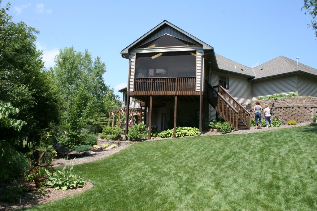 A rear view of Elizabeth Olson's house shows the steep hillside that defines her lot.
