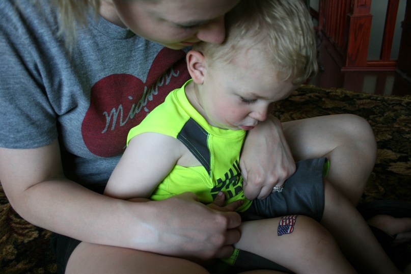 STEP TWO: Revealing the USA tattoo to Hank.