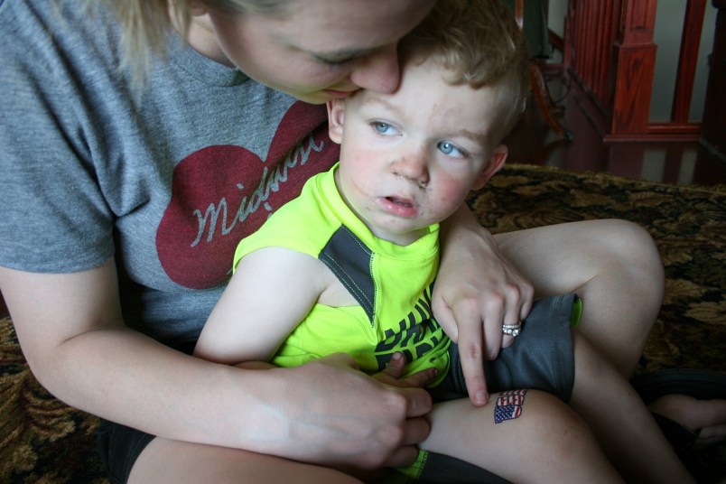 STEP TWO: Revealing a USA tattoo to a seemingly uninterested Hank.