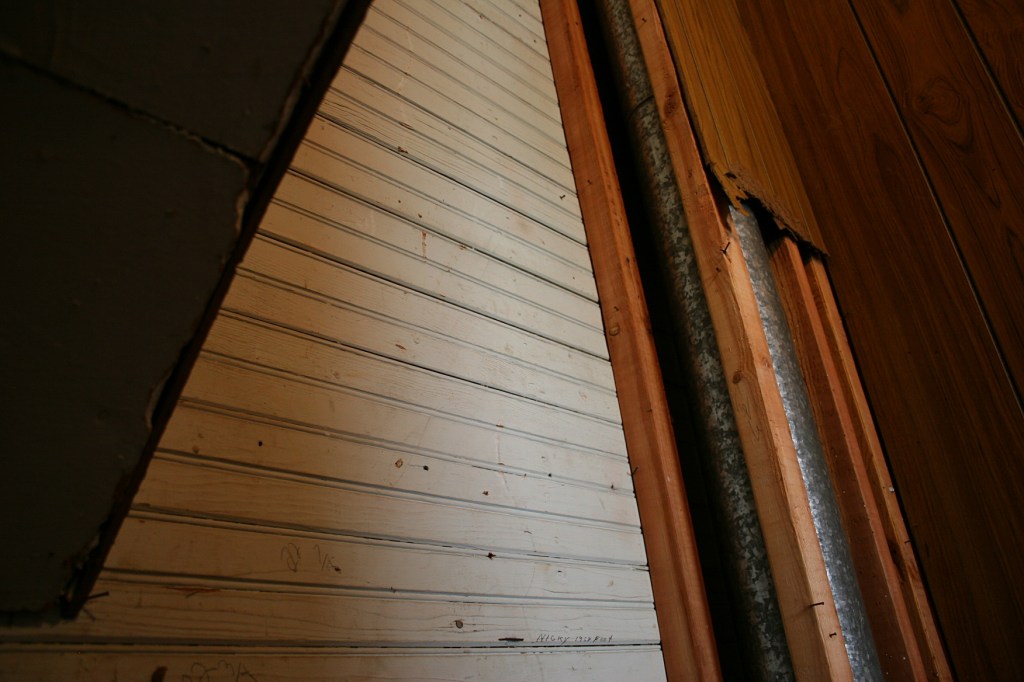 Original wainscoting uncovered beneath the paneling.