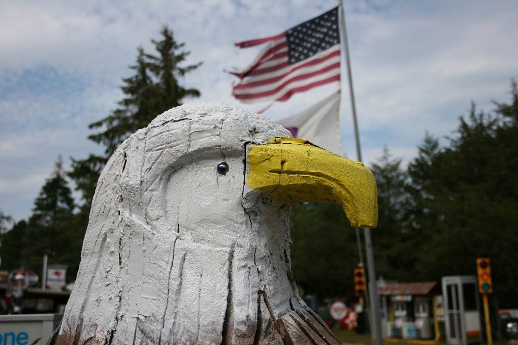 An eagle carved by Bing graces the circle drive entrance to his property.