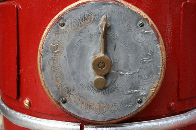 A gauge on a really old gas pump. 
