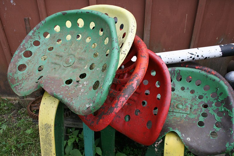Seats from farm implements appear as art to my eyes.