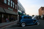 Faribault car show, blue car and downtown buildings