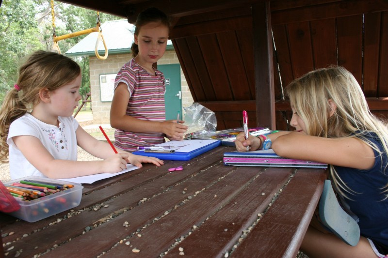 Cousins Meghan, left, Beth and Keira bond over artwork.