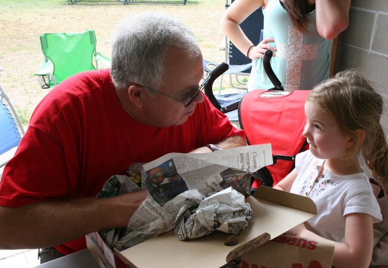 As Meghan helps her Great Uncle Marty open his birthday gift, the two exchange an endearing look.