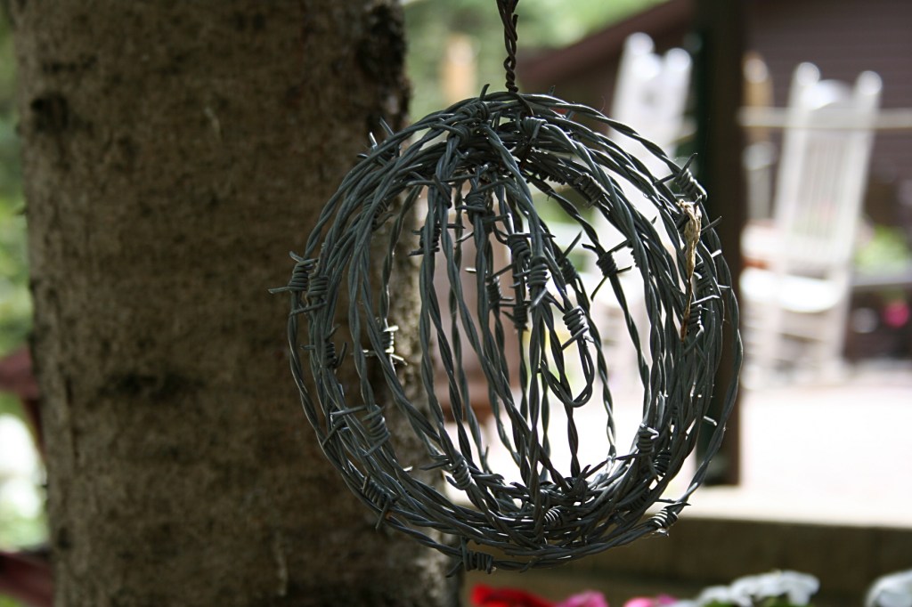 Seriously, how does one shape barbed wire into a ball?