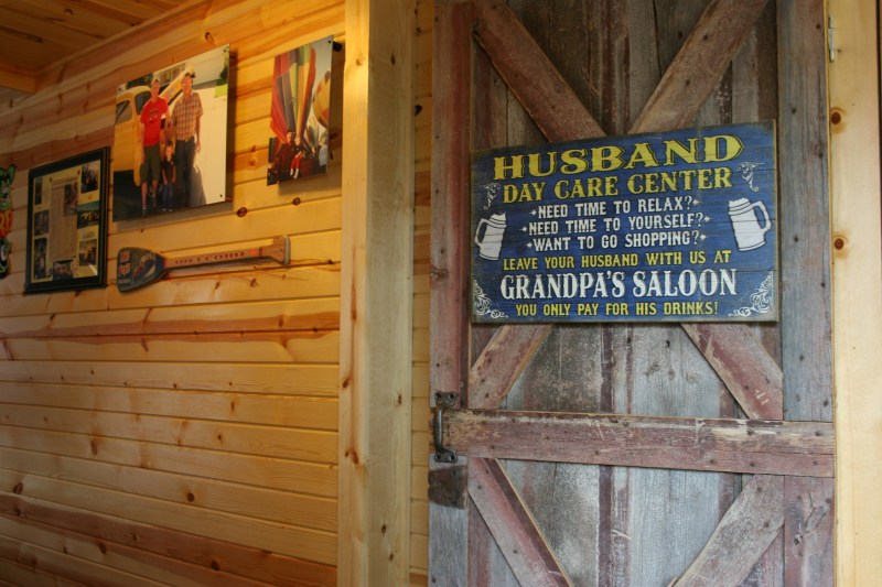Walk past this sign and into the next room to enter the bar area. On the other side of that you will find a gift shop, Laura's Place.