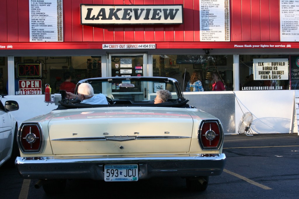A few cars, some vintage, managed to sneak into the drive-in among all the tractors.