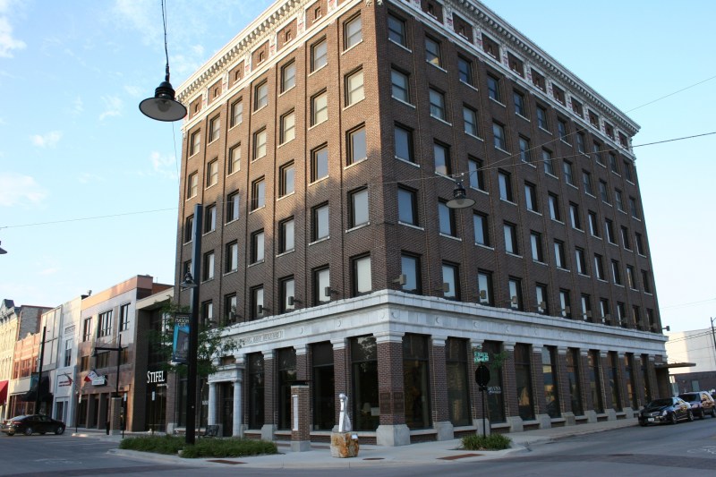 This downtown Mason City building dwarfs a corner placed sculpture, "The Thinker," by Serge Mozhnevsky.