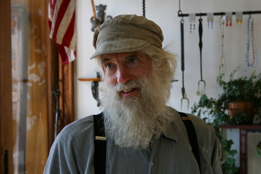 Tom looks the part of a craftsman.