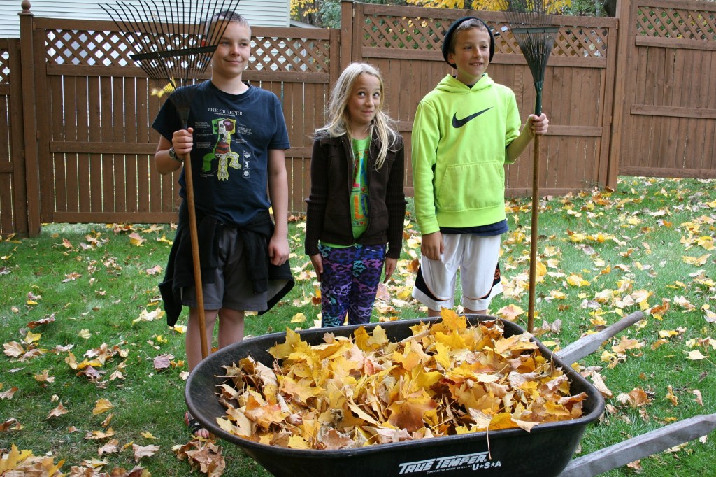 Posing Grant Wood style after raking leaves.
