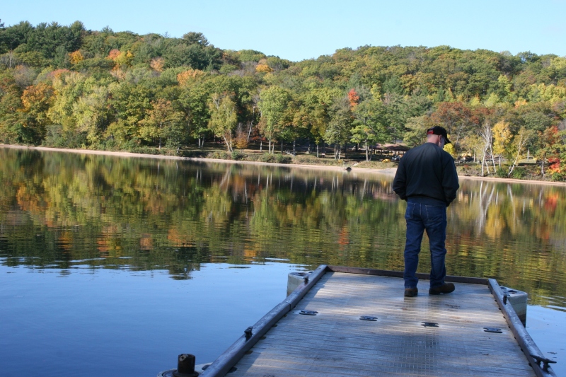 My husband on a dock at St. Croix Falls Lions Park along the St. Croix River.