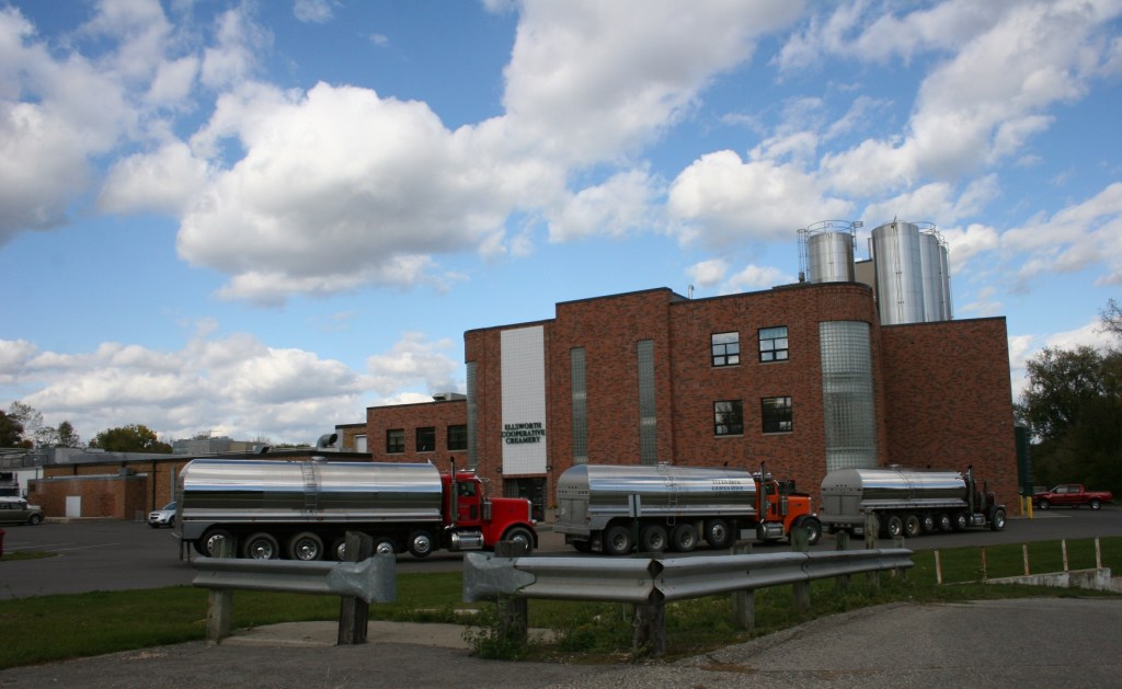 Trucks line up to deliver milk to the creamery.