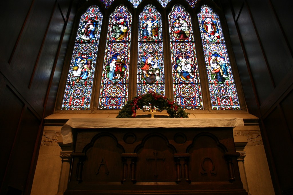 Looking up at the altar and the stunning stained glass windows above it.