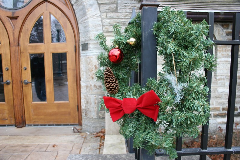 The exterior is tastefully and simply decorated for the holidays.