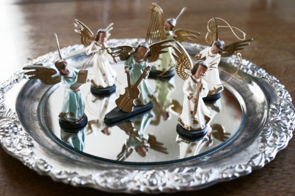 My oldest brother and I purchased this set of miniature plastic angels for our mom as a Christmas gift in the 1960s. Several years ago, my mom gave them back to me and I display them each Christmas. They are among my most treasured of holiday decorations.