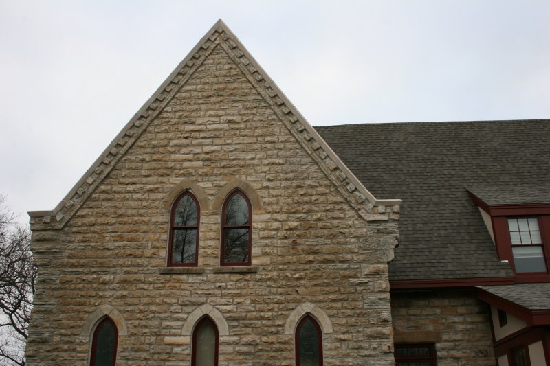 Detailed close-up of the old portion of the building flowing into new.