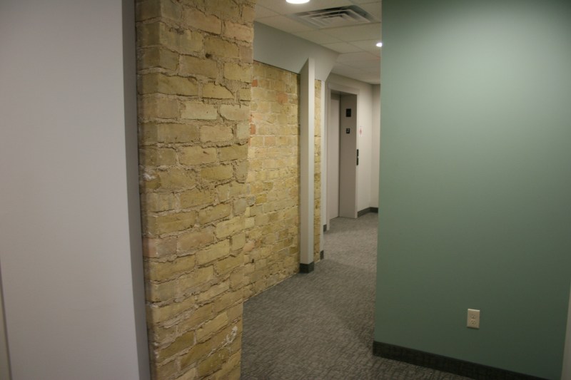 A maze of hallways, some featuring stone, lead to guest rooms.