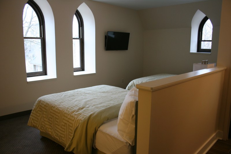 Church style windows add Old World charm to this guest room in the old part of The Inn.