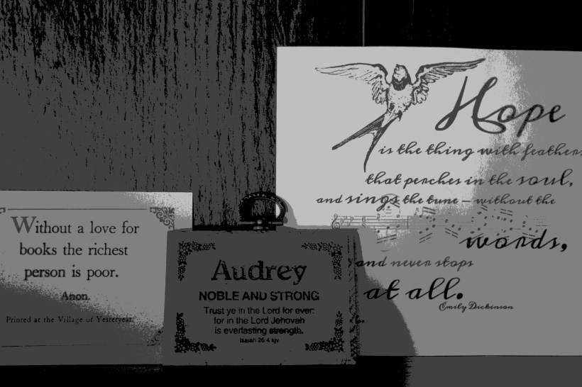 Inspirational quotes posted on my desk, on the shelf above my desktop screen.