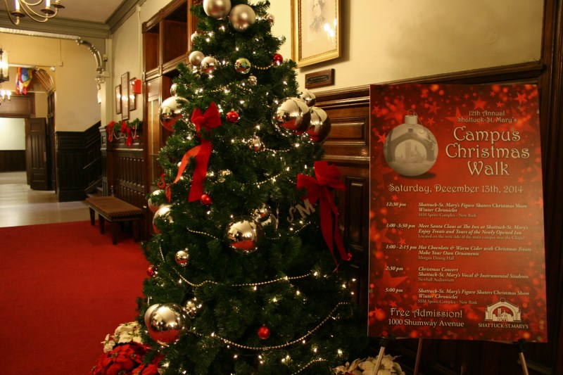 Inside Shumway Hall, a sign welcomes visitors to the annual Campus Christmas Walk.