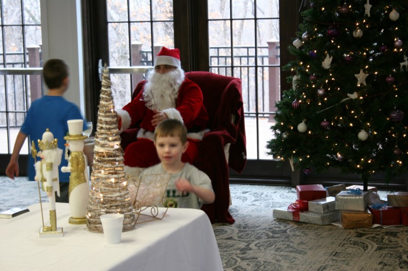 One boy headed for a treat after visiting Santa while another raced toward Santa's open arms at The Inn.
