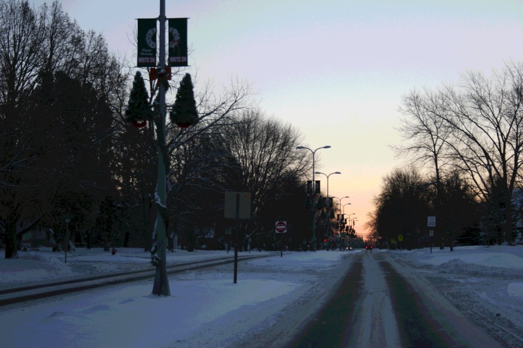 Driving into Kenyon, the view of the rising sun is temporarily blocked.
