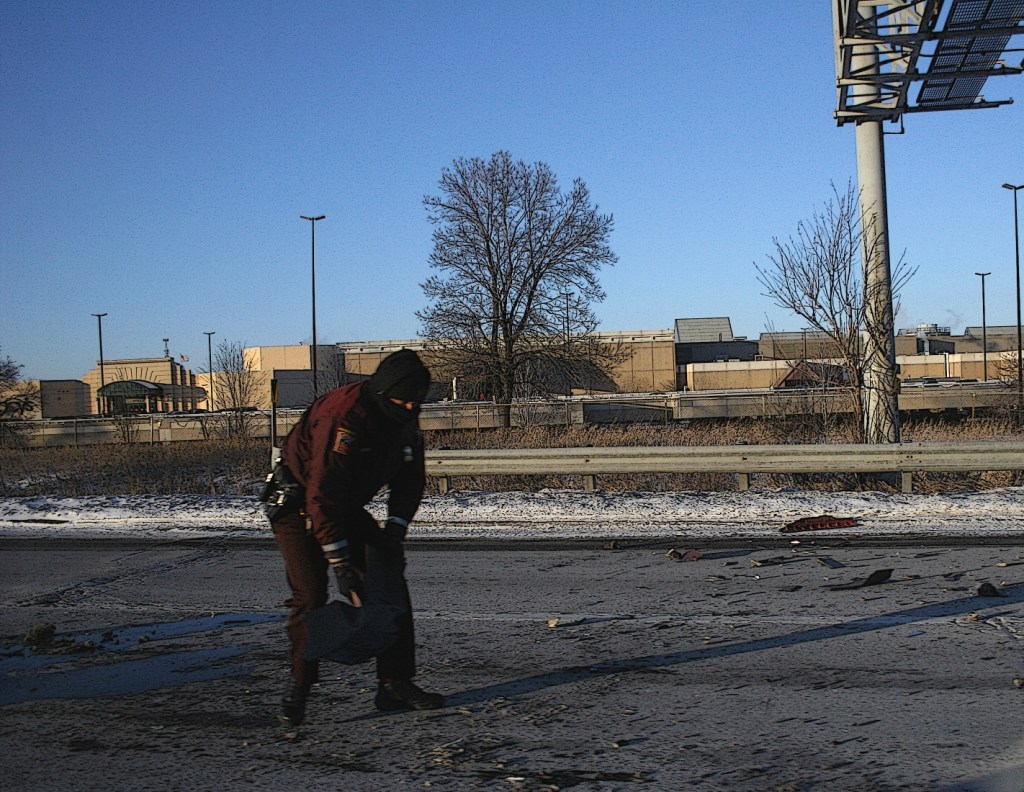 A tough job on a cold day, cleaning up after a crash.