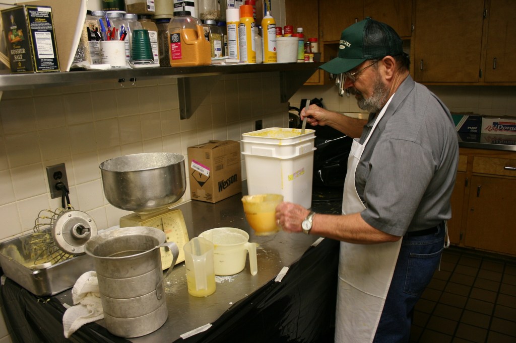 Bob Cross mixes pancake batter following his secret recipe.