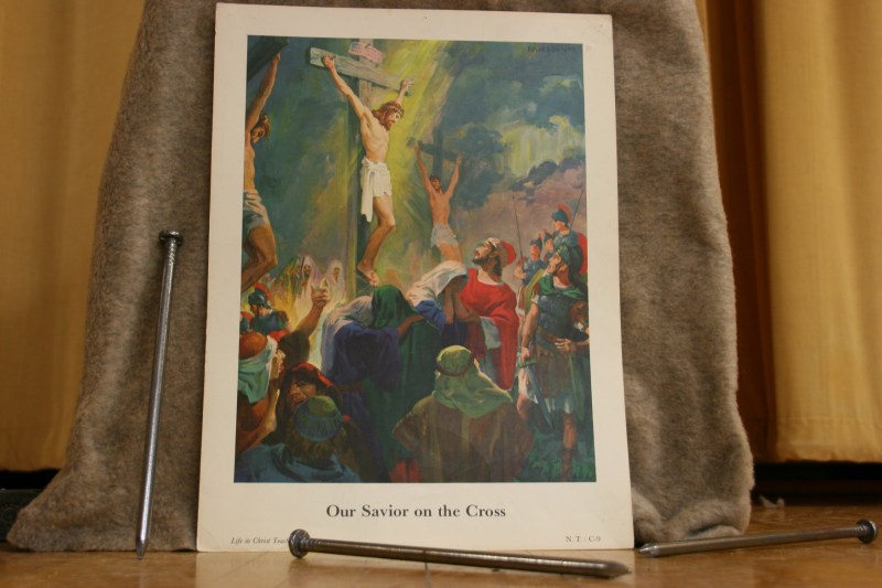 This artwork and nails were placed at the base of the cross.