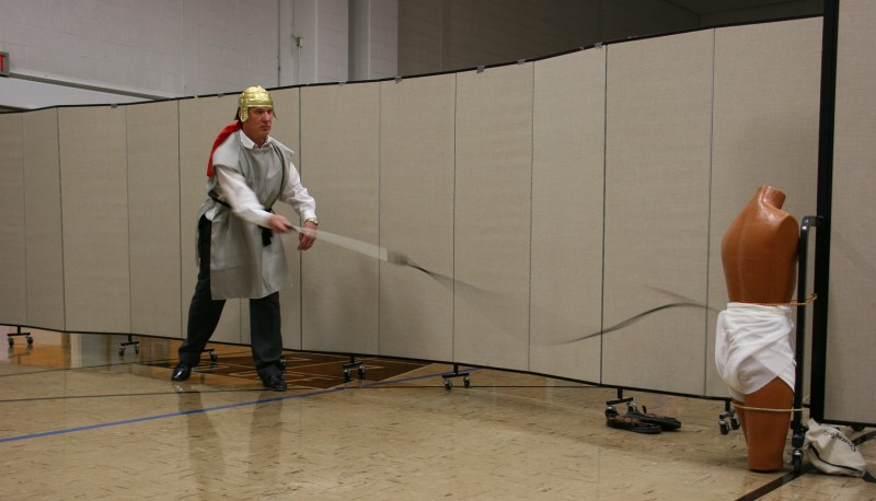 The whip cracked across the floor, toward the mannequin representing Jesus.