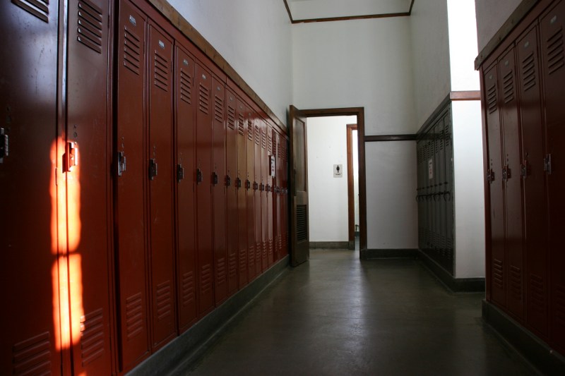 In a narrow hallway off the gym, leading to the women's bathroom, I discovered these rows of lockers painted in the school color.