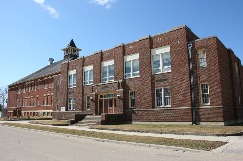 The building on the left, built in 1902 with a wing added in 1914, houses the West Concord Historical Society. On the right is the 1936 WPA project gym, 60 percent of its cost funded by the government.