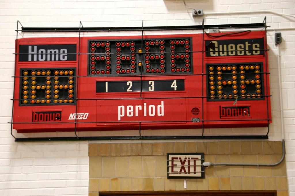 The original, non-digital, scoreboard that uses light bulbs still graces the 1936 former West Concord School gym.