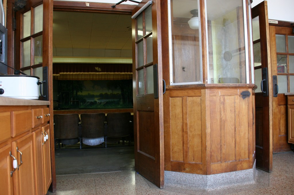 The original ticket booth remains just inside the front entry.